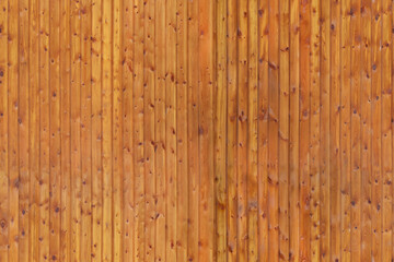 Naklejka premium Vertical wooden fence panels with natural texture outdoors during day