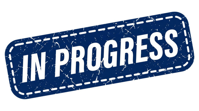 A blue grunge rubber stamp design with the text 'IN PROGRESS' prominently displayed