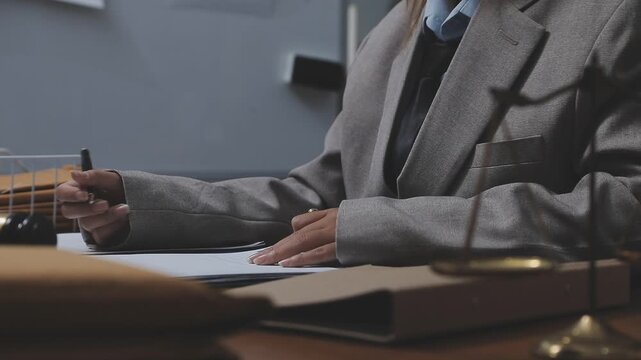 Law theme, mallet of the judge, law enforcement officers, evidence-based cases and documents taken into account.