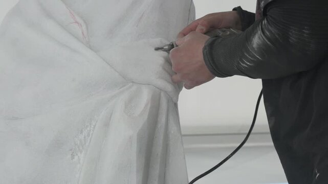 Marble Sculptor Carving Statue Detail with Chisel Close Up