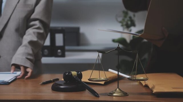 Law theme, mallet of the judge, law enforcement officers, evidence-based cases and documents taken into account.