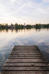 Fototapeta premium Rowboats at a wooden pier on Weßlinger See lake in Bavarian summer morning Weßling Bavaria 