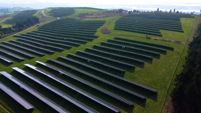 Aerial of Modern solar panel array. Technology and nature, sustainable energy production. Green technology, climate change solutions, and future infrastructure. Renewable Energy in Wales, UK.