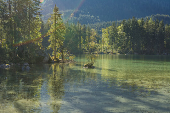 Idyllic Hintersee lake with small islands and Zauberwald Forest and Hochkalter mountain in Berchtesgaden Alps Ramsau
