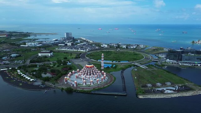 Aerial Coastal View of 99 Domes Mosque in Makassar by Losari Waterfront with CPI makassar as background, masjid kubah 99 makassar.