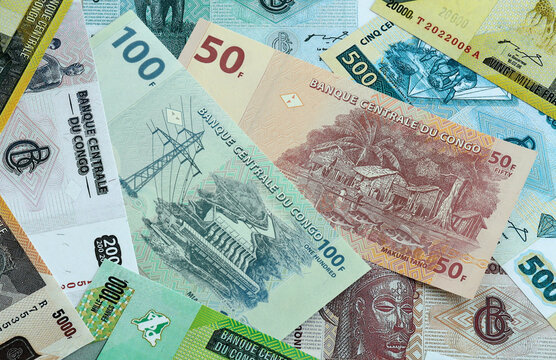 Congolese franc money banknotes pile on table. Republic of the Congo bills of XAF currency close up