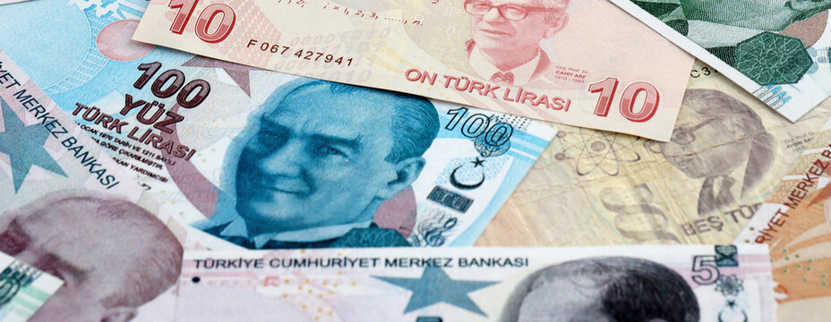 Turkish lira money banknotes pile on table. Turkey bills of TRY currency. Concept of economy