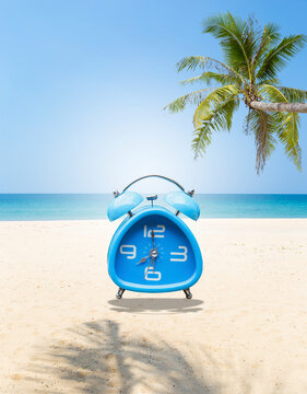 Vintage blue alarm clock on tropical beach background, it's summer time, season and weather, outdoor day light