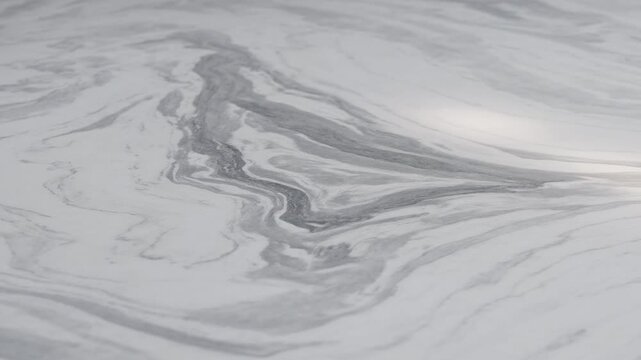 Close-up of white marble surface with grey veining patterns