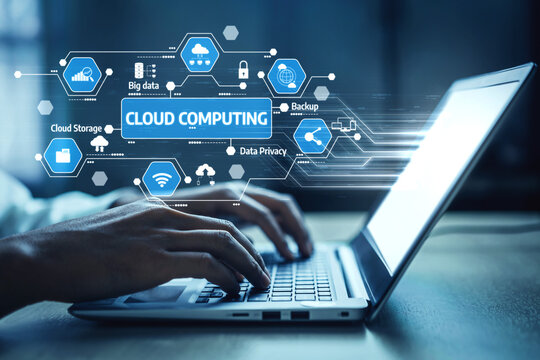 A close-up view of hands typing on a laptop keyboard, surrounded by cloud computing icons, symbolizing modern technology and digital solutions in a contemporary workspace setting. Tessel