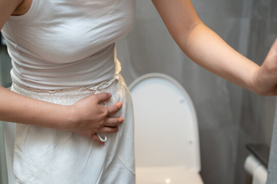 Constipation and diarrhea in bathroom. Hurt woman touch belly  stomach ache painful. colon inflammation problem, toxic food, abdominal pain, abdomen, constipated in toilet, stomachache, Hygiene