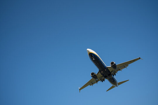 Bergamo, Italy - April 6, 2026: Dynamic shot of a commercial airplane landing at Orio al Serio Airport (BGY) in Bergamo, Italy, on a bright and sunny spring day