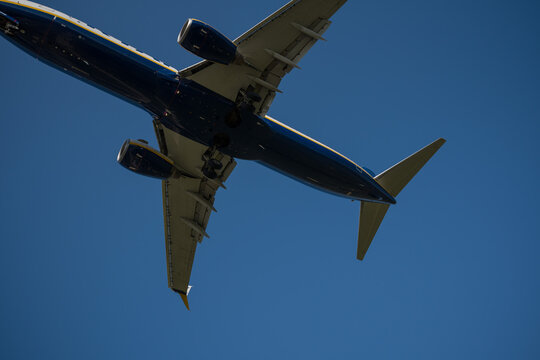 Bergamo, Italy - April 6, 2026: Dynamic shot of a commercial airplane landing at Orio al Serio Airport (BGY) in Bergamo, Italy, on a bright and sunny spring day