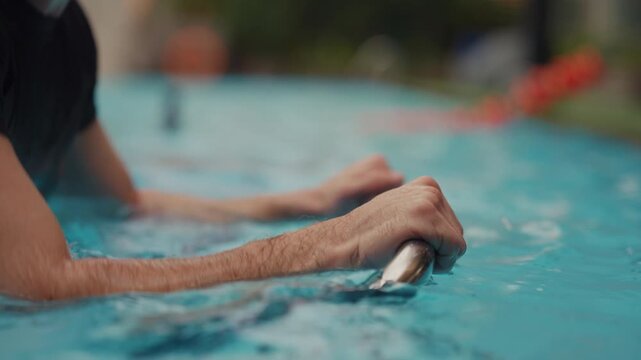 Men doing aqua spin with intense focus at a wellness center, embracing a healthy lifestyle with mindful fitness, holistic wellness, active recovery, balanced nutrition, stress management, and longevit