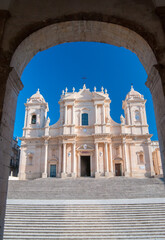 Obraz premium The Cathedral of San Nicolò in Noto, Sicily, seen from Palazzo Ducezio, headquarters of the local administration. The church in one of the best examples of the baroque architecture in the island