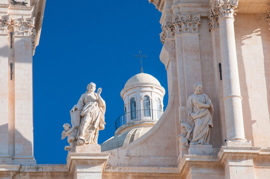 Closeup view of the statues of the Evangelists in the upper part of the baroque San Nicol&ograve; Cathedral in Noto, Sicily. 