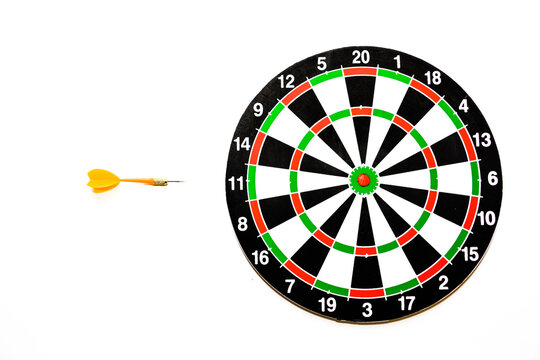 Dartboard with target and arrow isolated on a white background. Dartboard and dart arrow on white background. Business and success concept. Target and dart board. Dart arrow