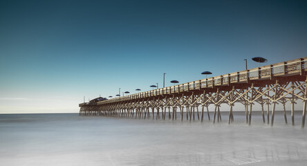 Fototapeta premium panorama long exposure of the Garden City Beach Pier in South Carolina