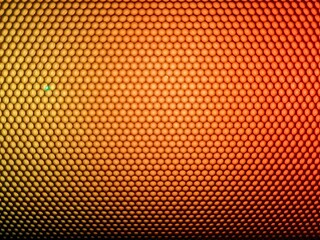Obraz premium Golden orange honeycomb pattern texture background with premium metallic finish
