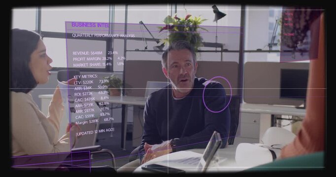 Seated man watching left rep showing report and causing BUSINESS INTEL UI stats for review