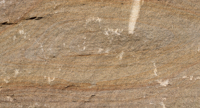 Top view of solid natural sandstone surface with rough grainy texture and horizontal crack showing detailed weathered geological pattern for construction background