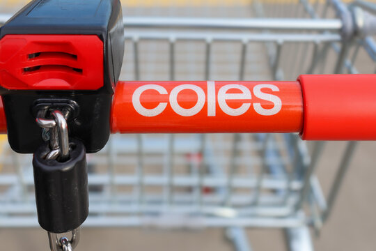 close up of Coles shopping cart handle and coin lock