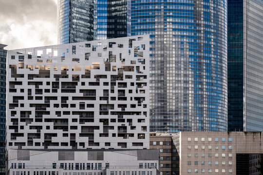 Patterned modern glass facade highlights corporate business finance architecture at La Defense Paris as contemporary buildings shape an office district texture backdrop