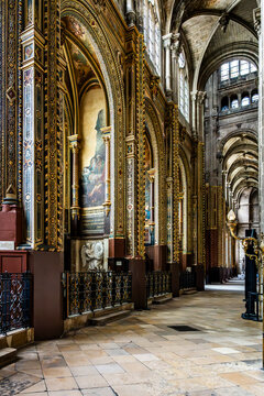 ide aisle inside Eglise Saint Eustache with arches and chapels, gothic architecture and religious interior space, in Paris, France