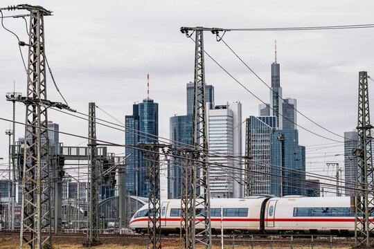 Urban skyline of Frankfurt Germany beside railway where train speed reflects transport infrastructure and travel across the city today