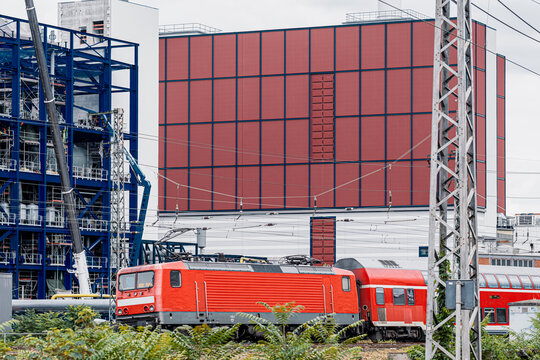 Frankfurt Germany urban transit corridor with modern red train on railway tracks highlights infrastructure for daily travel scene today