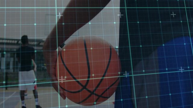 Foreground player adjusting basketball grip for drill, teammate stepping toward hoop, grid aligning