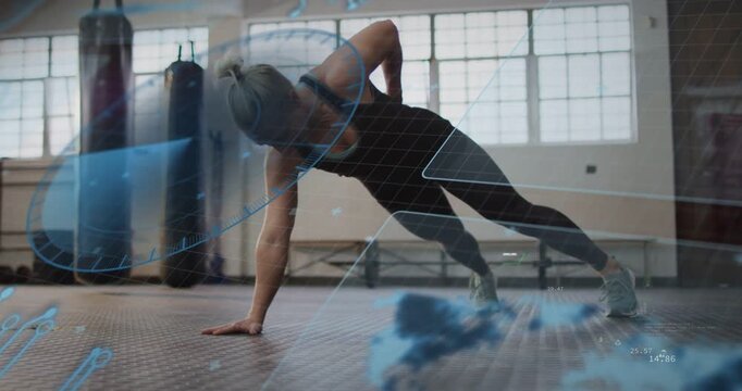 Vertical video: Woman shifting into rotating side-plank while HUD tracking fitness data for core