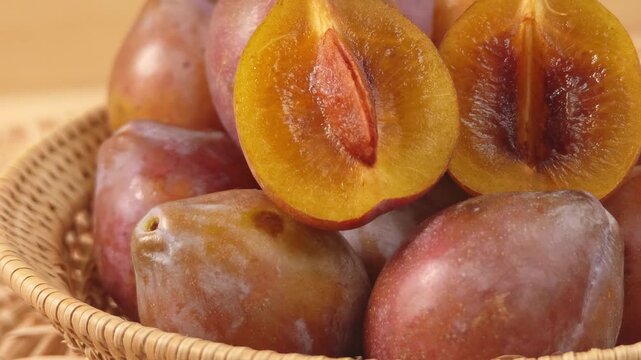Fresh prunes in a basket.