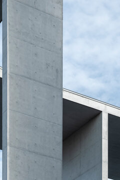Modern concrete architecture beam and column structure framed by sky with minimalist geometry and brutalist design creating abstract background