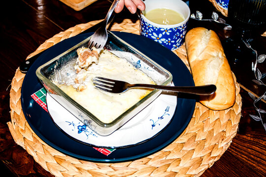 Homemade comfort food and bread on a cozy family dinner table