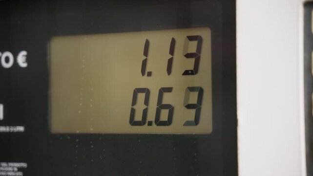 Gasoline meter gradually increases at gas station 