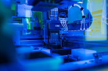 Obraz premium Specialized Microassembly Environment Featuring Robotic Equipment And Lighted Modular Testing Platforms