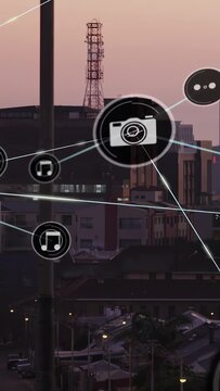 Vertical video: Tech network forming from node growing above skyline showing camera music links