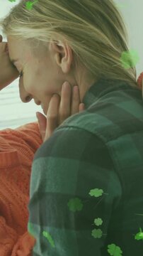 Vertical video: Orange woman cupping her jaw, leading forehead touch for social, clovers framing