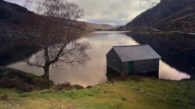 Llyn Ogwen Boathouse and Mountain Reflection, Eryri Snowdonia National Park, North Wales, UK