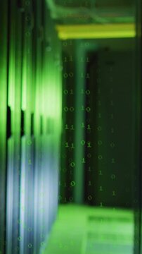 Vertical video: Server racks being revealed by camera push, binary rain falling, showing data flow