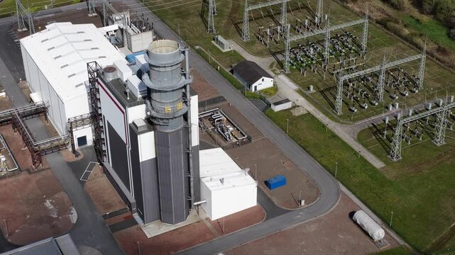 Aerial view of a modern gas fired power plant and electrical substation