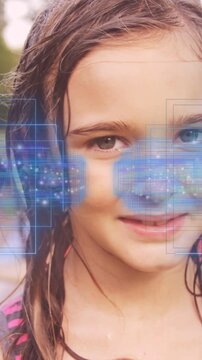Girl reacting to camera crop and play, smiling, moving with tech HUD squares drifting over face
