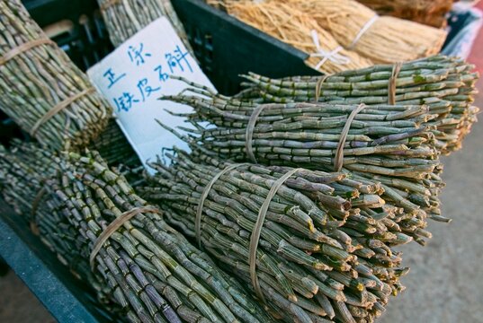 Dendrobium officinale as Shidiehuo or Tiepi Shihu is one of the most prestigious and expensive "noble" herbs in Traditional Chinese Medicine (TCM). It is a variety of orchid sold at a market in Baisha