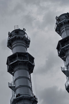 Heavy industry runs through a refinery plant where towers facility infrastructure engineering steel pipes and structure support the process