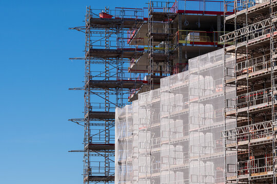 Architecture in Oslo shows construction scaffolding renovation on a building facade where engineering and structure meet safety for industry