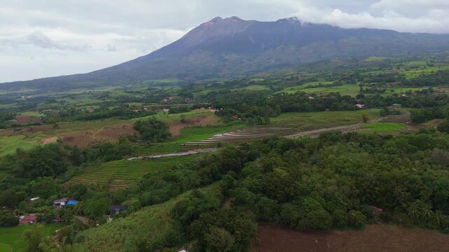 Aerial look at the lush tropical valley and hills at the base of Mount Canlaon in Canlaon City, Negros Oriental, Philippines. Fertile volcanic land and remote terrain