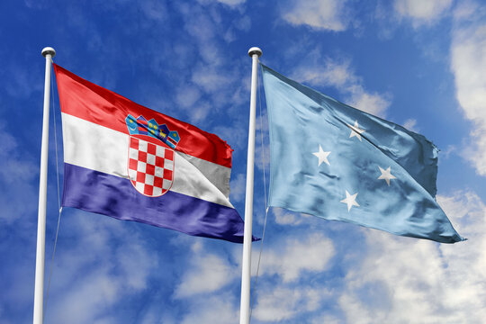 Croatia and Micronesia flags waving in a clear blue sky, symbolizing a powerful diplomacy, a strategic partnership, and a shared vision of unity for a sustainable future.