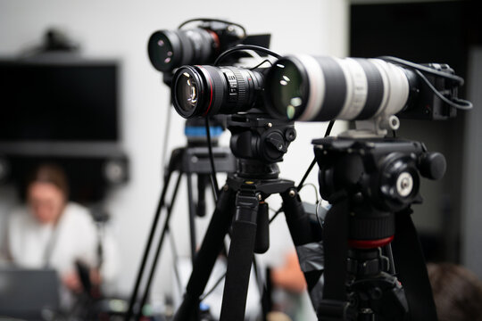 Professional video cameras on tripods during a live broadcast or event filming