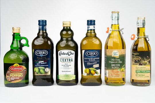 LVIV, UKRAINE - NOVEMBER 12, 2025: Editorial shot of various bottles of Italian extra virgin olive oil including Cirio, Costa d Oro and Coppini